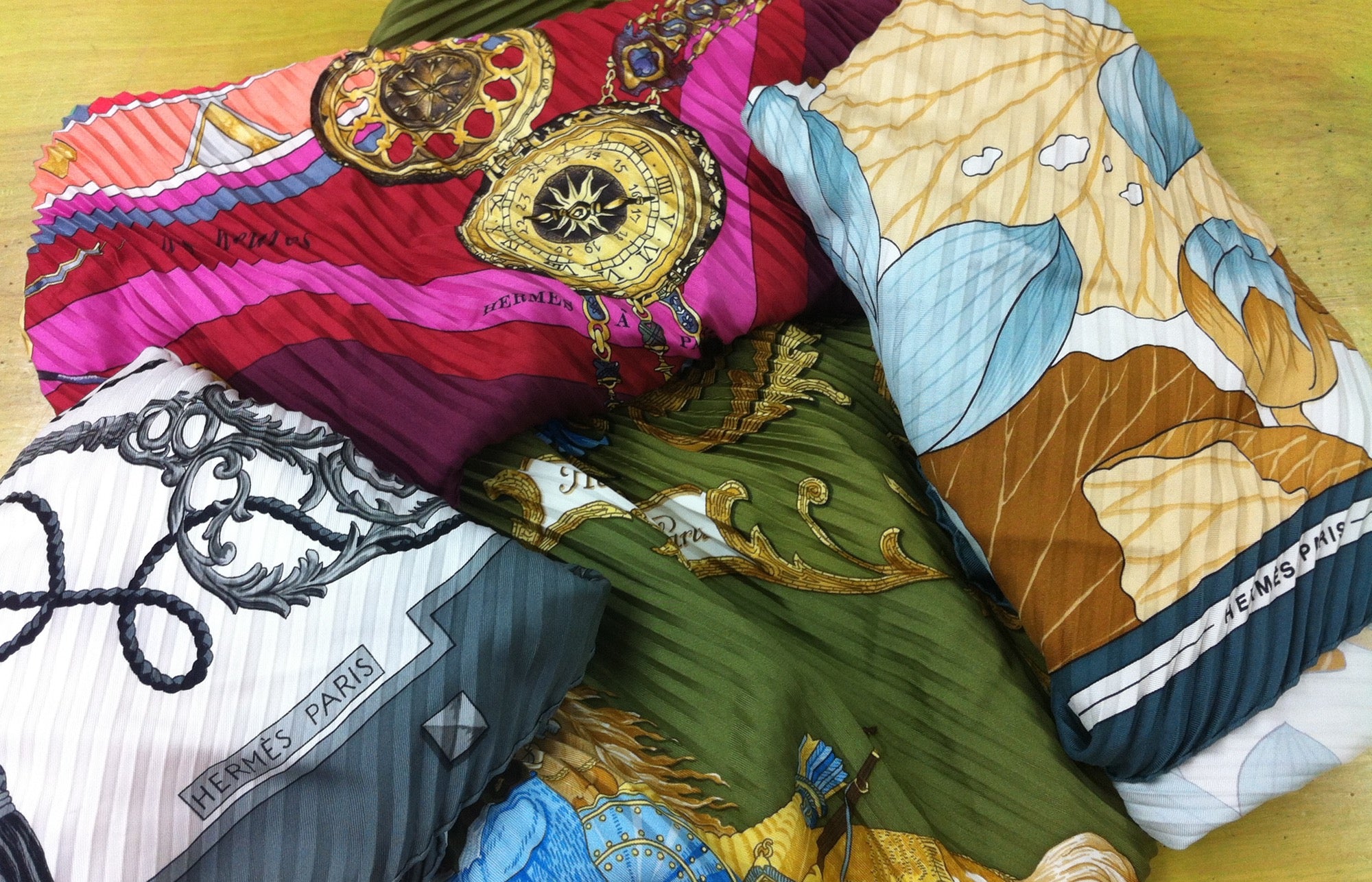 Hermes Scarves with pleats that have fallen out that are ready to be repaired