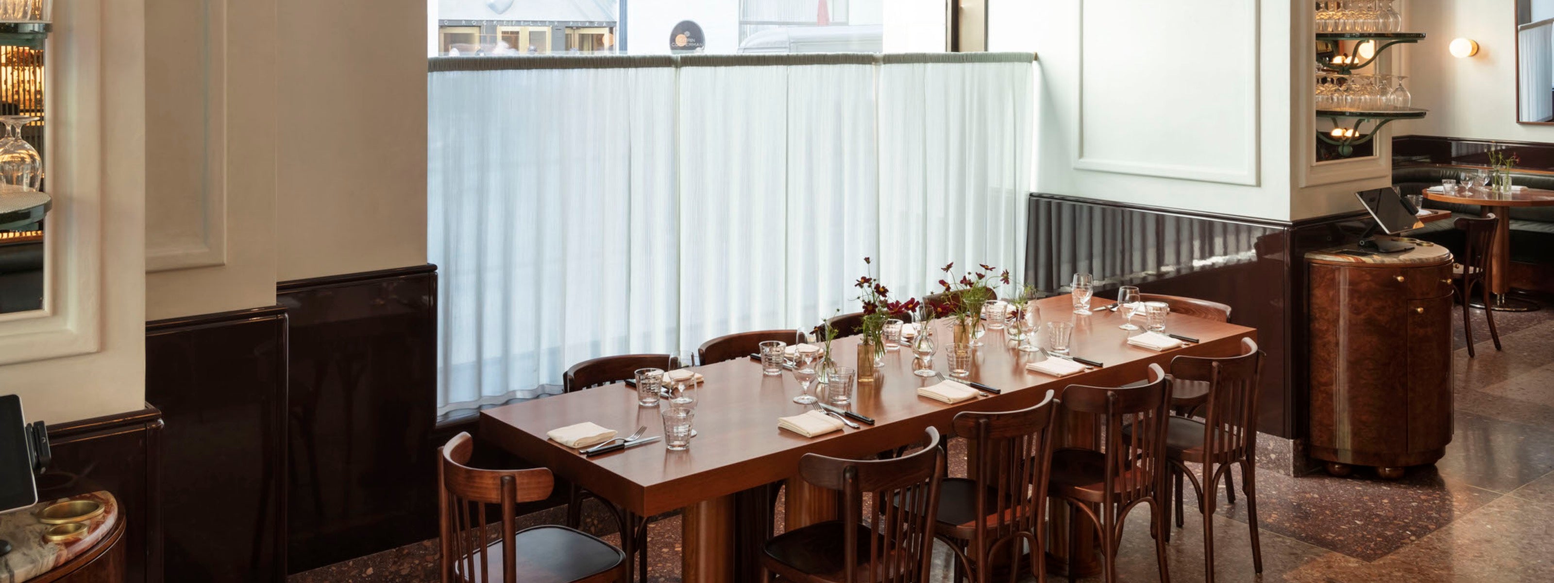French brasserie table setting from Le Rock Restaurant by Workstead with pleated curtains by Tom's Sons International Pleating and Erik Bruce