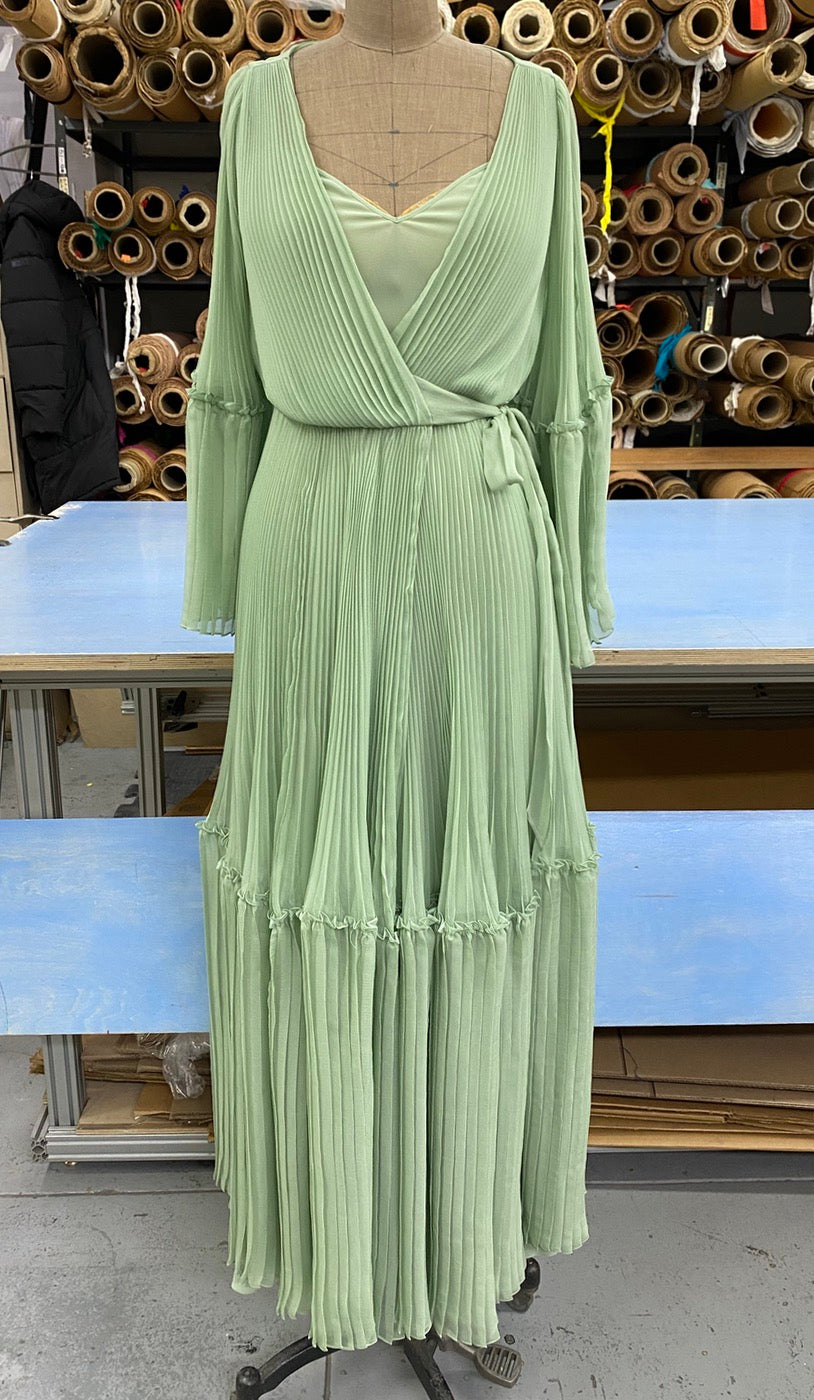 Light green Christian Dior pleated wrap dress on a mannequin with restored pleats