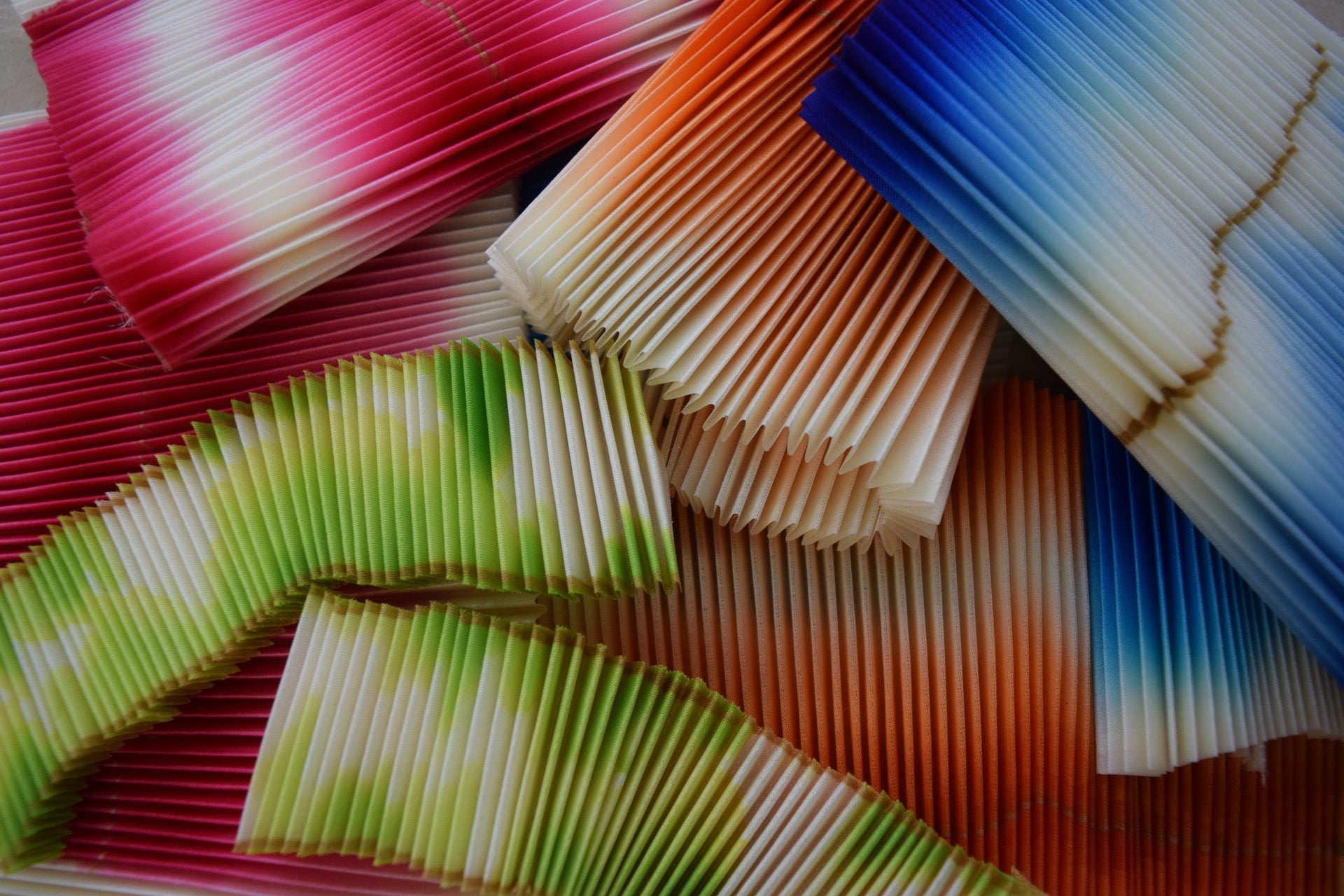 Accordion pleated silk dyed in various colors