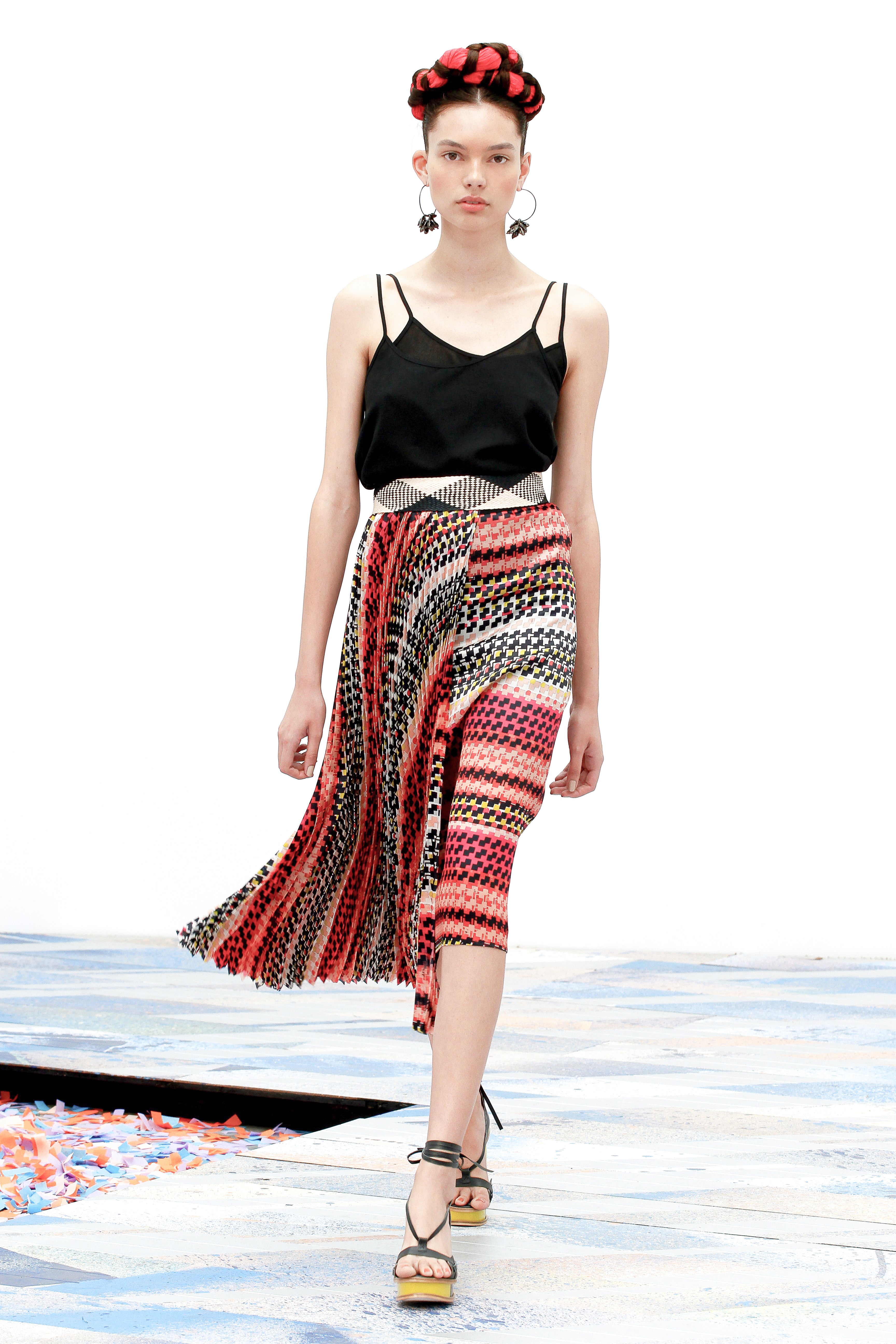 black camisole with a geometric printed skirt with a sunburst accordion panel on the front 